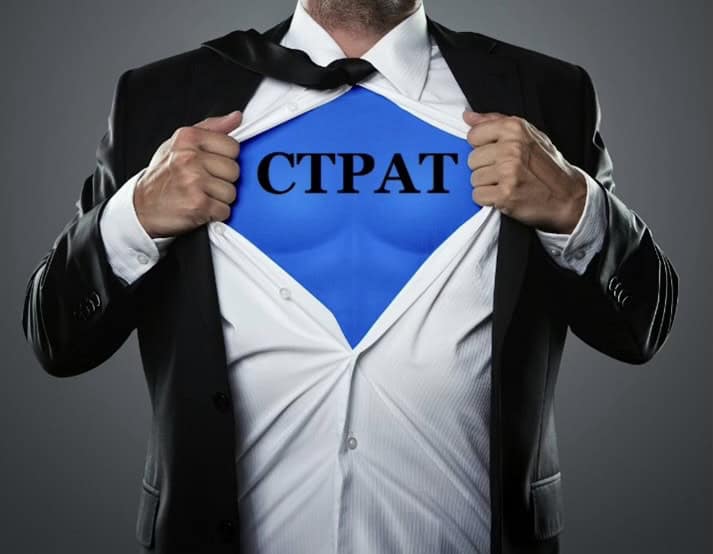 Businessman revealing a blue 'CTPAT' emblem like a superhero symbol.