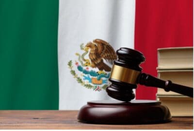 Gavel and Mexican flag representing law and justice in Mexico.