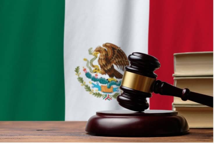Gavel and Mexican flag representing law and justice in Mexico.